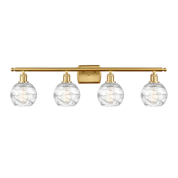 Deco Swirl Bath Vanity Light shown in the Satin Gold finish with a Clear shade