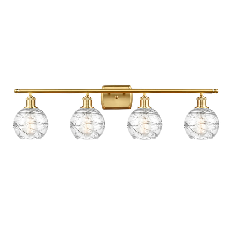 Deco Swirl Bath Vanity Light shown in the Satin Gold finish with a Clear shade