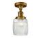 Colton Semi-Flush Mount shown in the Brushed Brass finish with a Clear Halophane shade