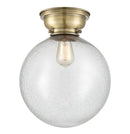 Beacon Flush Mount shown in the Antique Brass finish with a Seedy shade