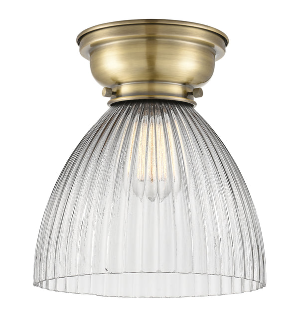 Seneca Falls Flush Mount shown in the Antique Brass finish with a Clear Halophane shade