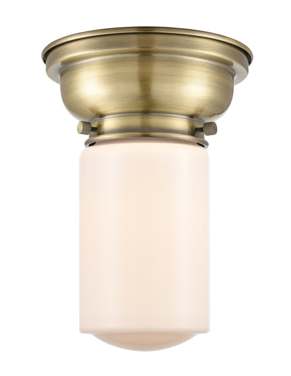 Dover Flush Mount shown in the Antique Brass finish with a Matte White shade