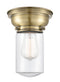 Dover Flush Mount shown in the Antique Brass finish with a Clear shade