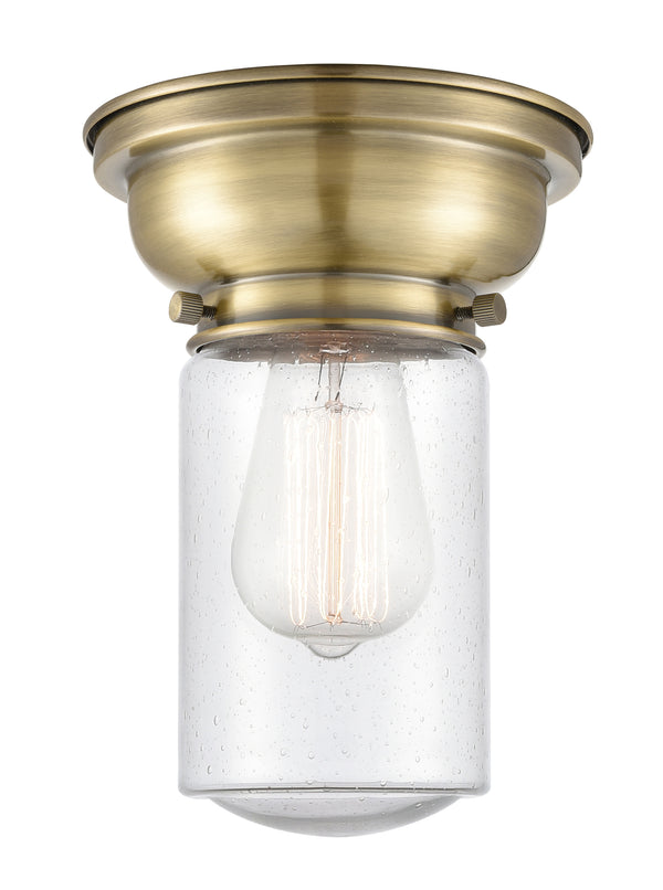 Dover Flush Mount shown in the Antique Brass finish with a Seedy shade
