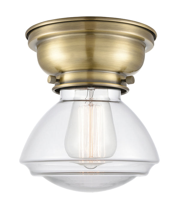 Olean Flush Mount shown in the Antique Brass finish with a Clear shade