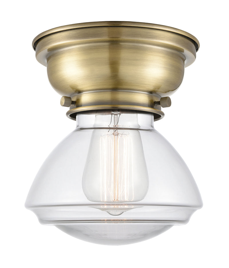 Olean Flush Mount shown in the Antique Brass finish with a Clear shade