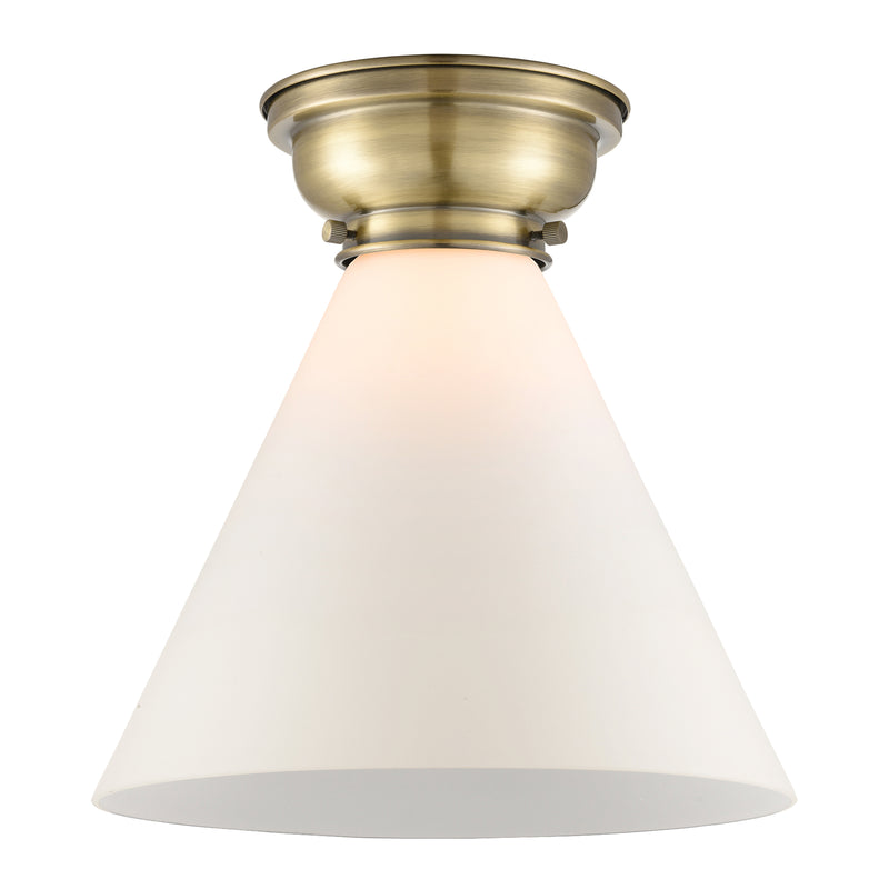Cone Flush Mount shown in the Antique Brass finish with a Matte White shade