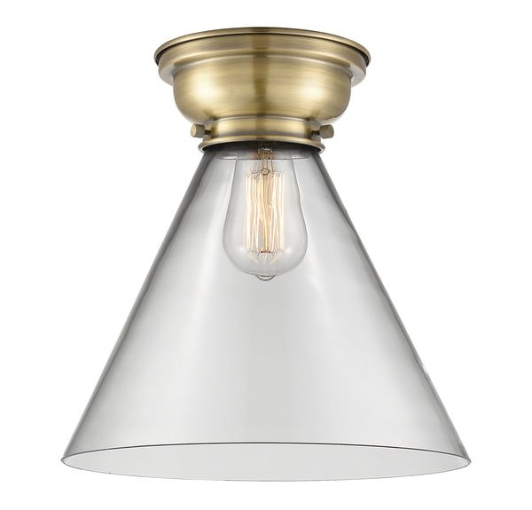 Cone Flush Mount shown in the Antique Brass finish with a Clear shade