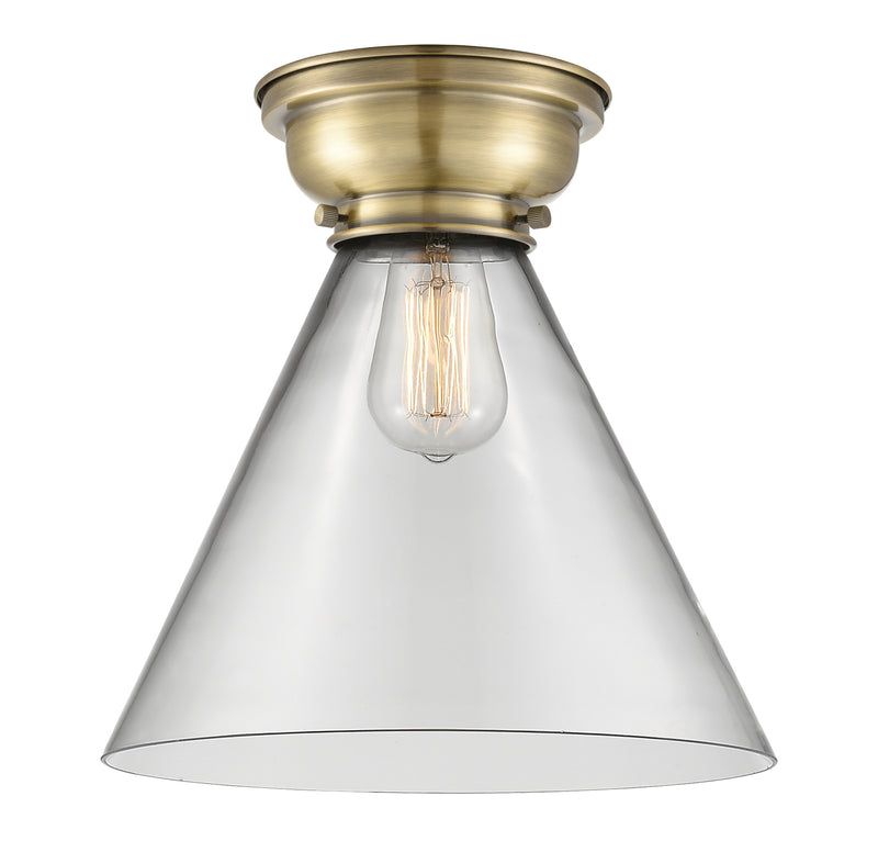Cone Flush Mount shown in the Antique Brass finish with a Clear shade