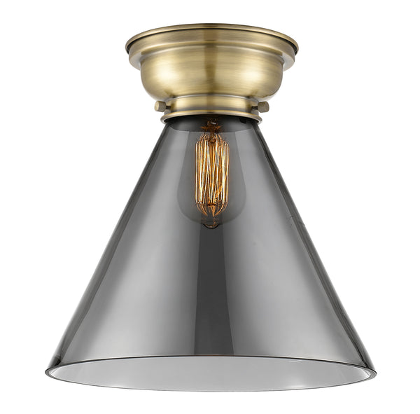 Cone Flush Mount shown in the Antique Brass finish with a Plated Smoke shade