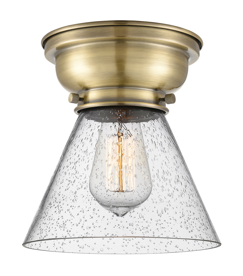 Cone Flush Mount shown in the Antique Brass finish with a Seedy shade