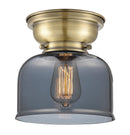 Bell Flush Mount shown in the Antique Brass finish with a Plated Smoke shade