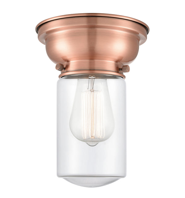 Dover Flush Mount shown in the Antique Copper finish with a Clear shade