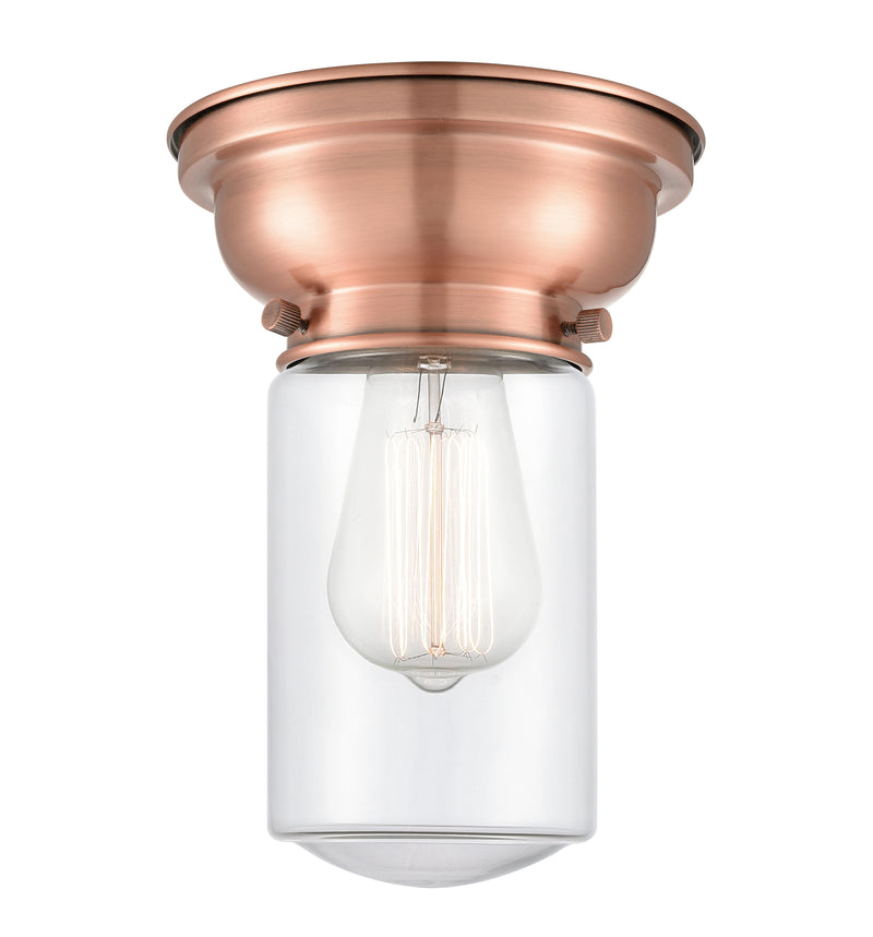 Dover Flush Mount shown in the Antique Copper finish with a Clear shade