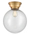 Beacon Flush Mount shown in the Brushed Brass finish with a Seedy shade