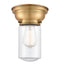 Dover Flush Mount shown in the Brushed Brass finish with a Clear shade