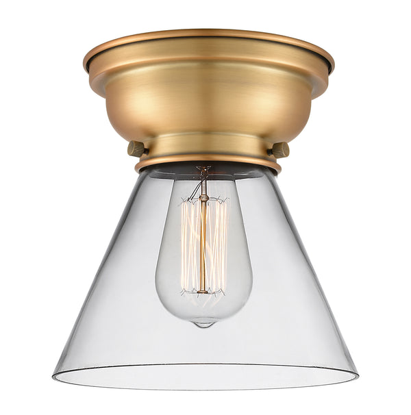 Cone Flush Mount shown in the Brushed Brass finish with a Clear shade