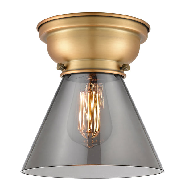 Cone Flush Mount shown in the Brushed Brass finish with a Plated Smoke shade