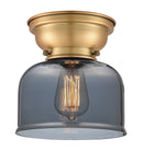 Bell Flush Mount shown in the Brushed Brass finish with a Plated Smoke shade