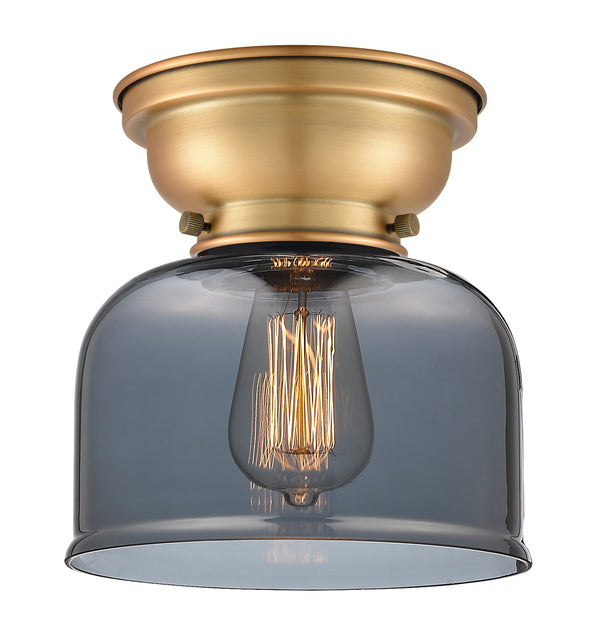 Bell Flush Mount shown in the Brushed Brass finish with a Plated Smoke shade