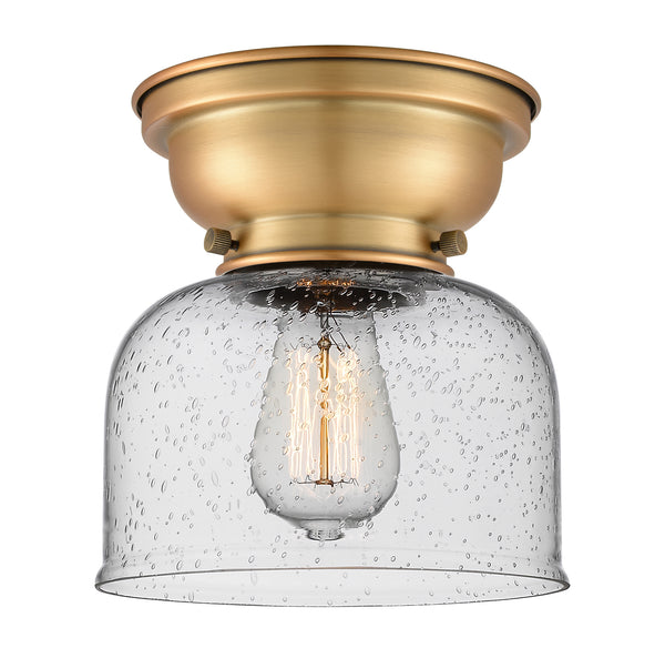 Bell Flush Mount shown in the Brushed Brass finish with a Seedy shade