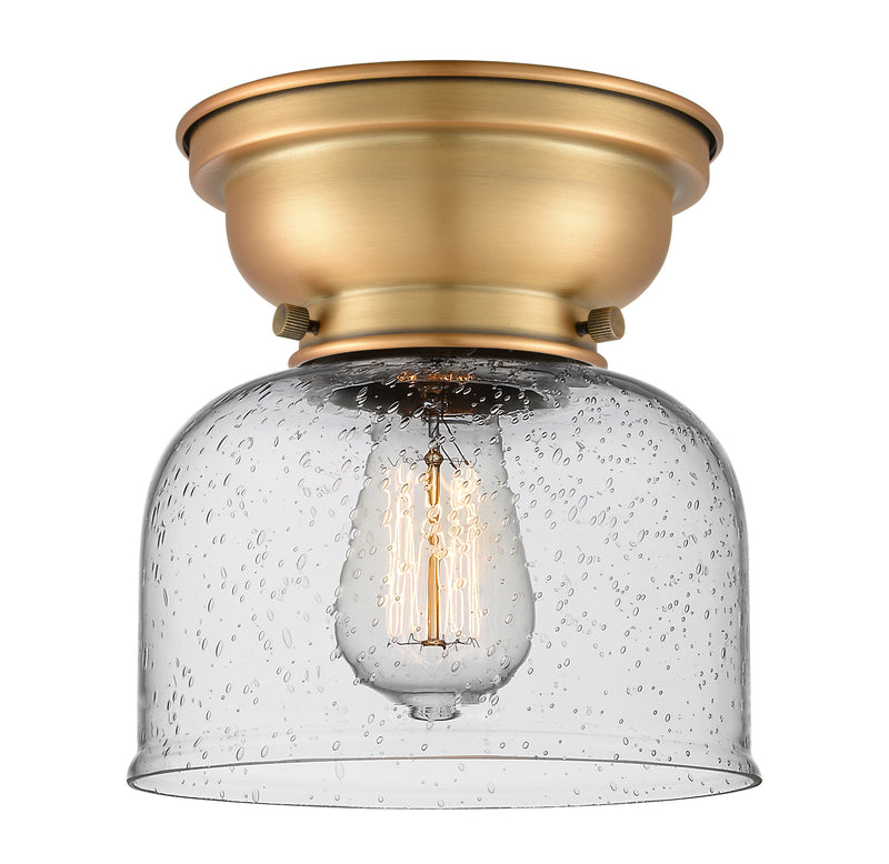 Bell Flush Mount shown in the Brushed Brass finish with a Seedy shade