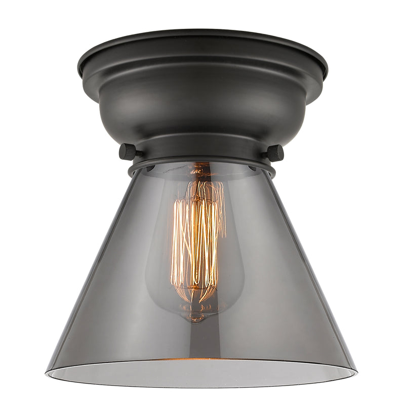 Cone Flush Mount shown in the Matte Black finish with a Plated Smoke shade