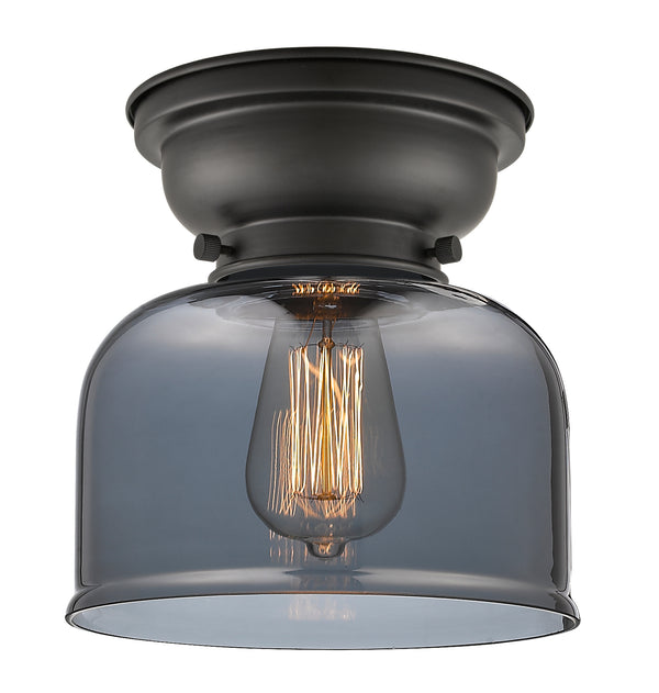 Bell Flush Mount shown in the Matte Black finish with a Plated Smoke shade