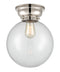 Beacon Flush Mount shown in the Polished Nickel finish with a Clear shade