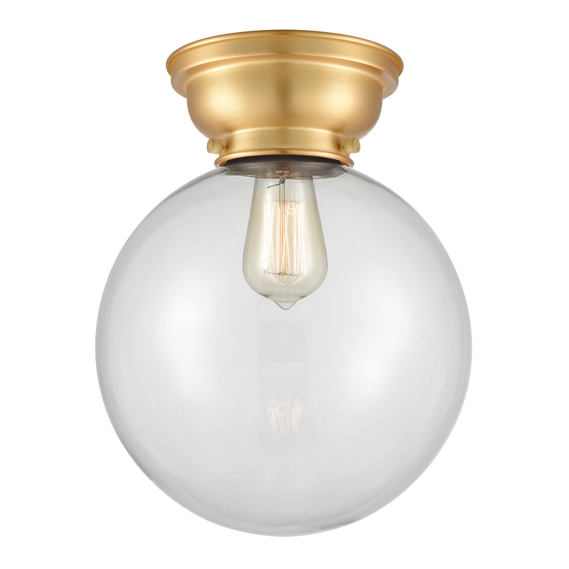 Beacon Flush Mount shown in the Satin Gold finish with a Clear shade
