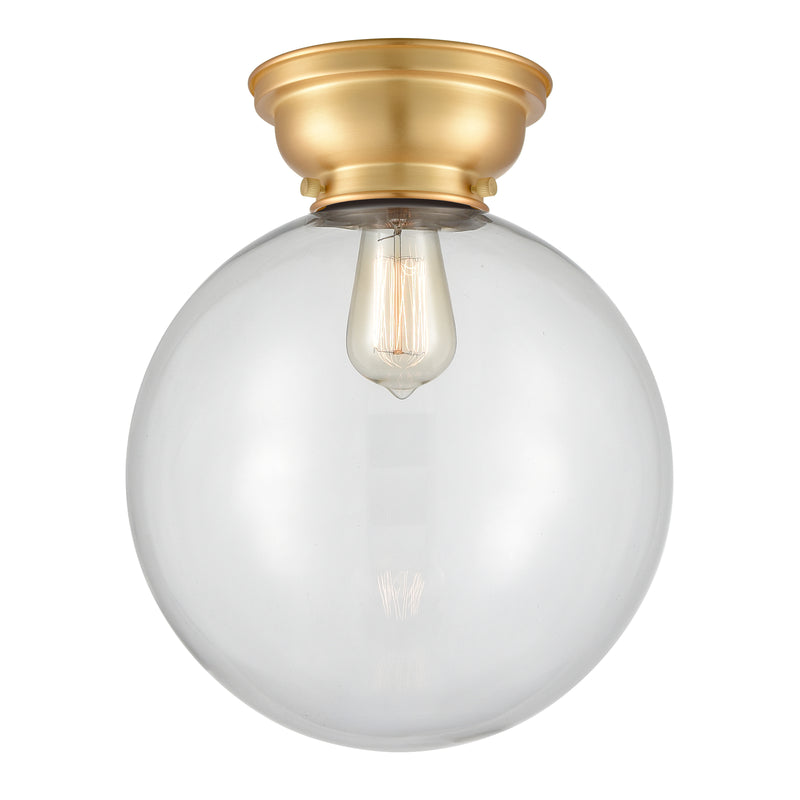 Beacon Flush Mount shown in the Satin Gold finish with a Clear shade