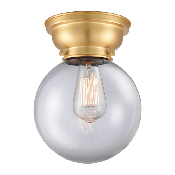 Beacon Flush Mount shown in the Satin Gold finish with a Clear shade