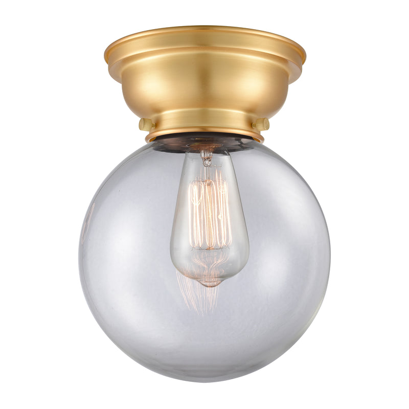 Beacon Flush Mount shown in the Satin Gold finish with a Clear shade