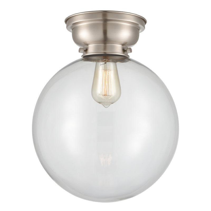 Beacon Flush Mount shown in the Brushed Satin Nickel finish with a Clear shade