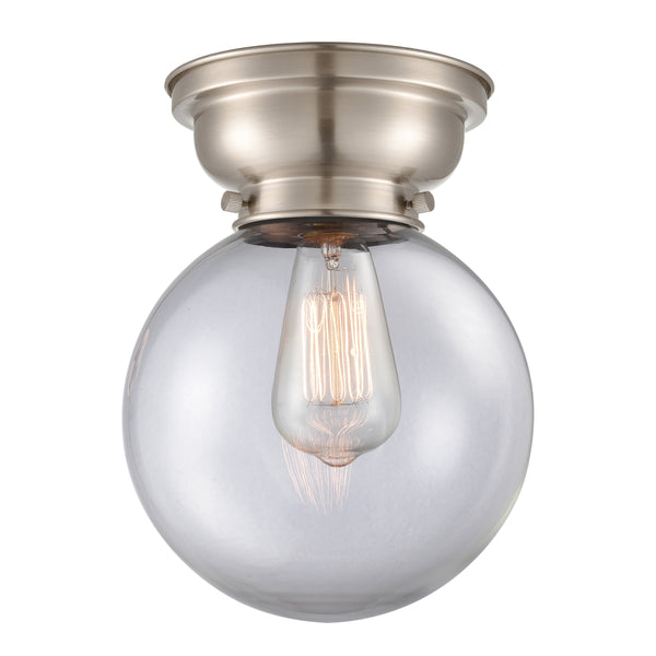 Beacon Flush Mount shown in the Brushed Satin Nickel finish with a Clear shade