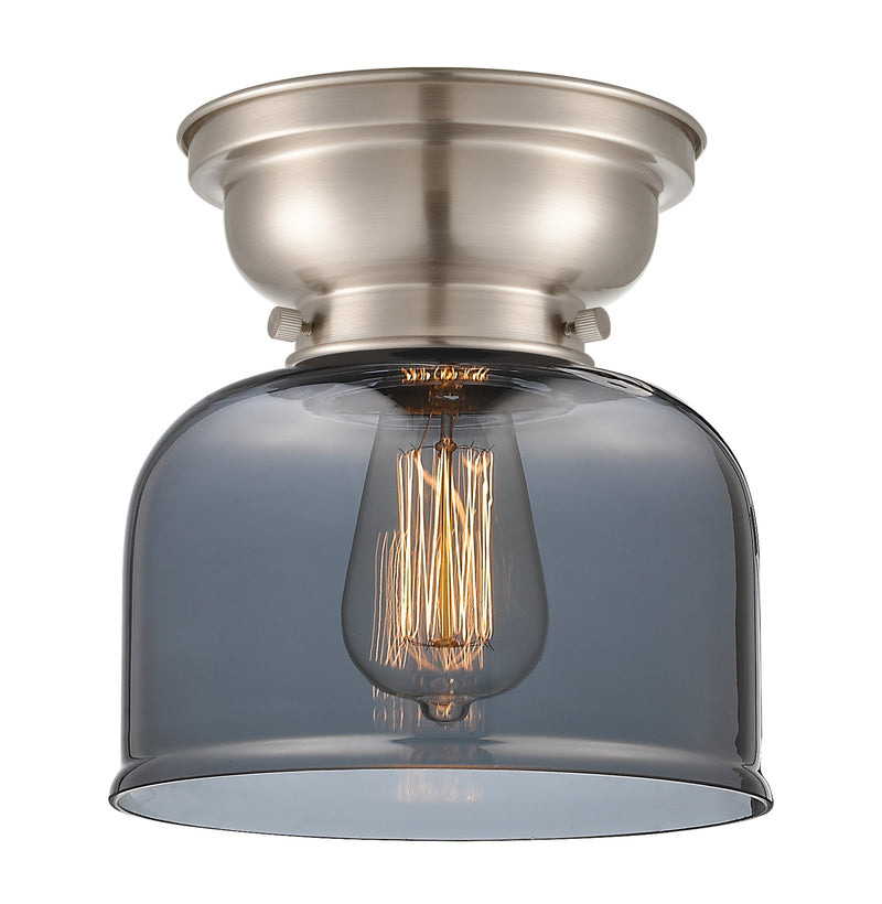 Bell Flush Mount shown in the Brushed Satin Nickel finish with a Plated Smoke shade