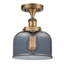 Bell Semi-Flush Mount shown in the Brushed Brass finish with a Plated Smoke shade