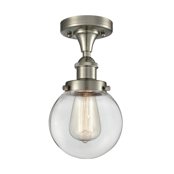 Beacon Flush Mount shown in the Brushed Satin Nickel finish with a Clear shade