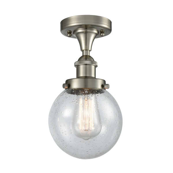 Beacon Flush Mount shown in the Brushed Satin Nickel finish with a Seedy shade