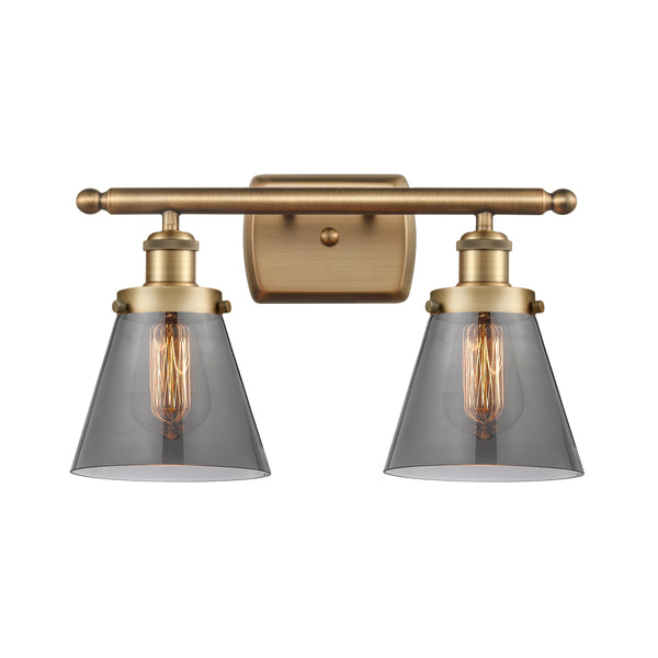 Cone Bath Vanity Light shown in the Brushed Brass finish with a Plated Smoke shade