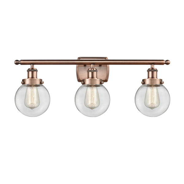 Beacon Bath Vanity Light shown in the Antique Copper finish with a Clear shade