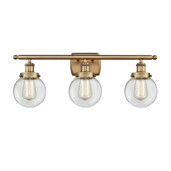 Beacon Bath Vanity Light shown in the Brushed Brass finish with a Clear shade
