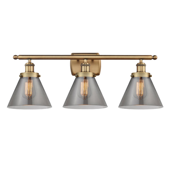 Cone Bath Vanity Light shown in the Brushed Brass finish with a Plated Smoke shade