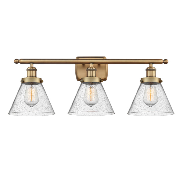 Cone Bath Vanity Light shown in the Brushed Brass finish with a Seedy shade