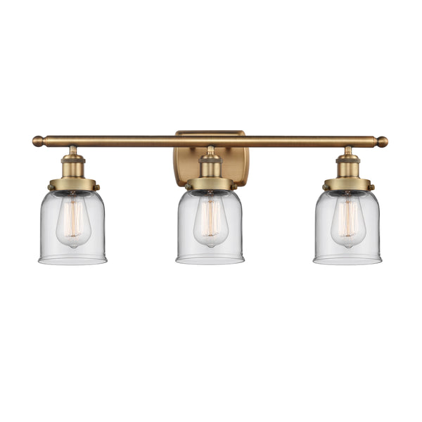 Bell Bath Vanity Light shown in the Brushed Brass finish with a Clear shade