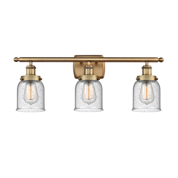 Bell Bath Vanity Light shown in the Brushed Brass finish with a Seedy shade