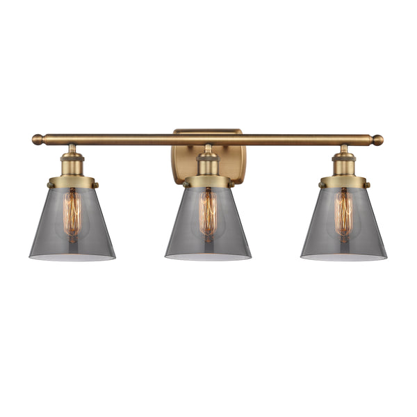 Cone Bath Vanity Light shown in the Brushed Brass finish with a Plated Smoke shade