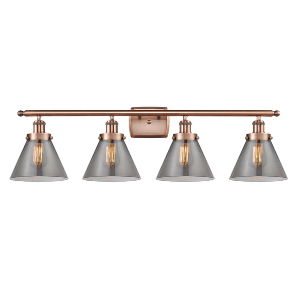 Cone Bath Vanity Light shown in the Antique Copper finish with a Plated Smoke shade