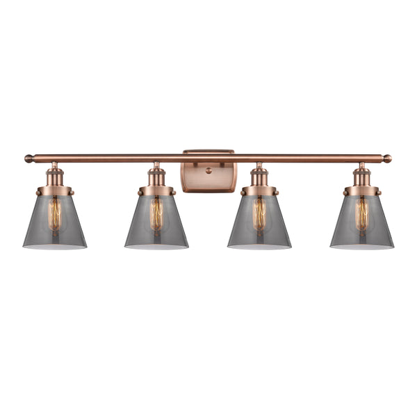 Cone Bath Vanity Light shown in the Antique Copper finish with a Plated Smoke shade