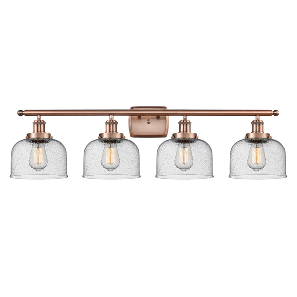 Bell Bath Vanity Light shown in the Antique Copper finish with a Seedy shade